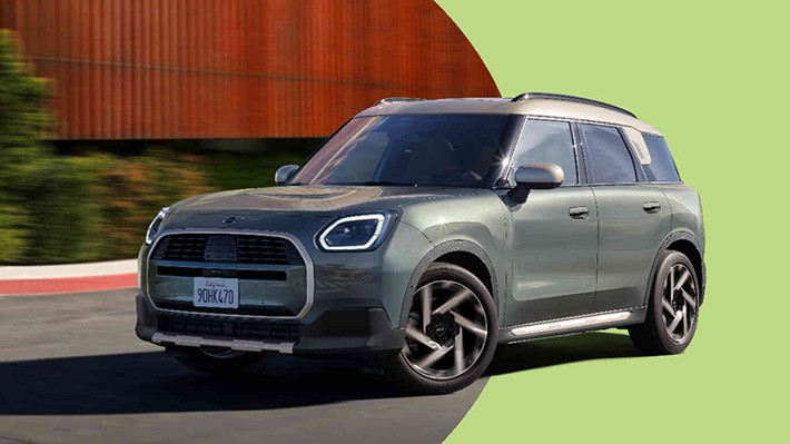 MINI Countryman driving three-quarter side view MINI Countryman driving three-quarter side view
